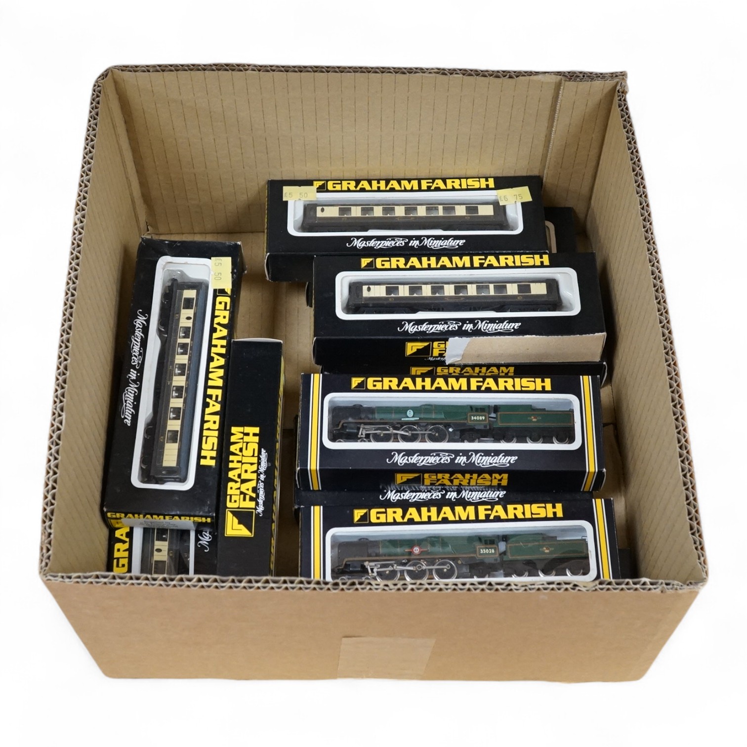 Eleven boxed Graham Farish N gauge railway, including two locomotives; a Rebuilt Merchant Navy Class Clanline 35028 (1513) and a Rebuilt Battle of Britain Class 602 Squadron 34089 (1515), together with nine bogie Pullman